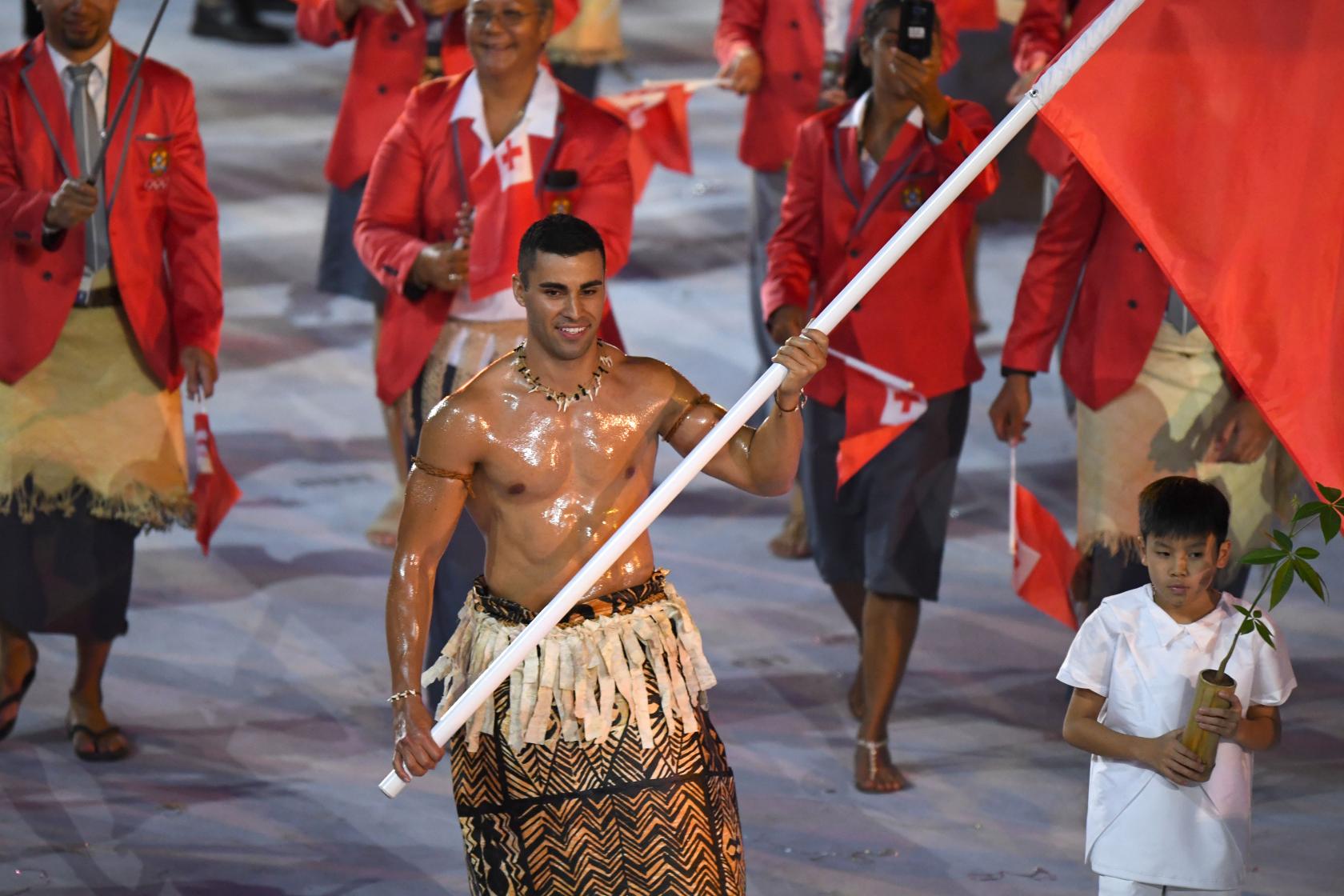 Tonga's flagbearer Pita Nikolas Taufatofua leads his delegation during the opening ceremony of the Rio 2016 Olympic Games at the Maracana stadium in Rio de Janeiro on August 5, 2016. / AFP / OLIVIER MORIN (Photo credit should read OLIVIER MORIN/AFP/Getty Images)