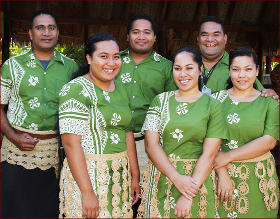 Image of 6 staff members from Tongan descent dressed in matching green outfits