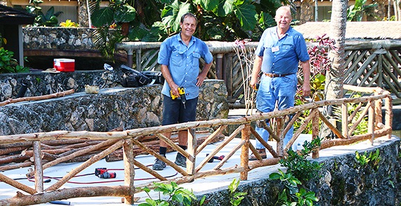 Photo of Elder Green and Nelson assisting with facility improvements at the Polynesian Cultural Center. Photo by Mike Foley