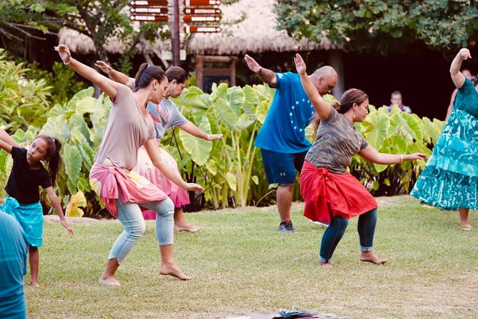 photo of PCC staff and community workes learning the Hula Pahu, a traditional hula used to strengthen the morale of native Hawaiians