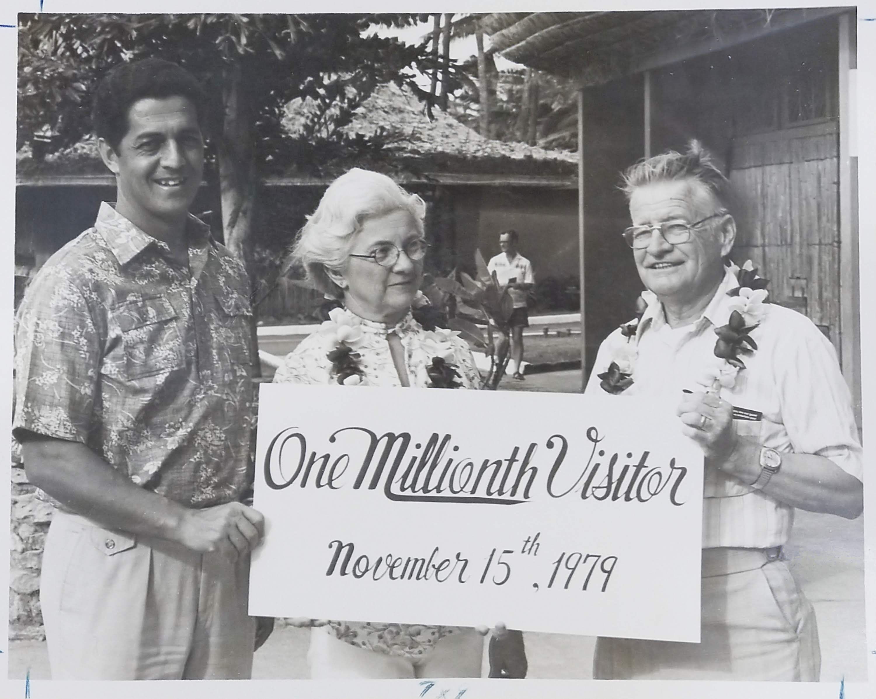 photo of Bill Craven , as President and General Manager of the Polynesian Cultural Center recognizing the one millionth guest at the Center.