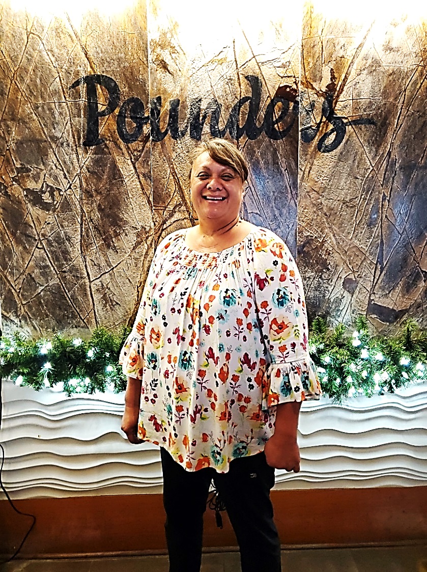 Photo of Dede Alo, general manager of Pounders Restaurant