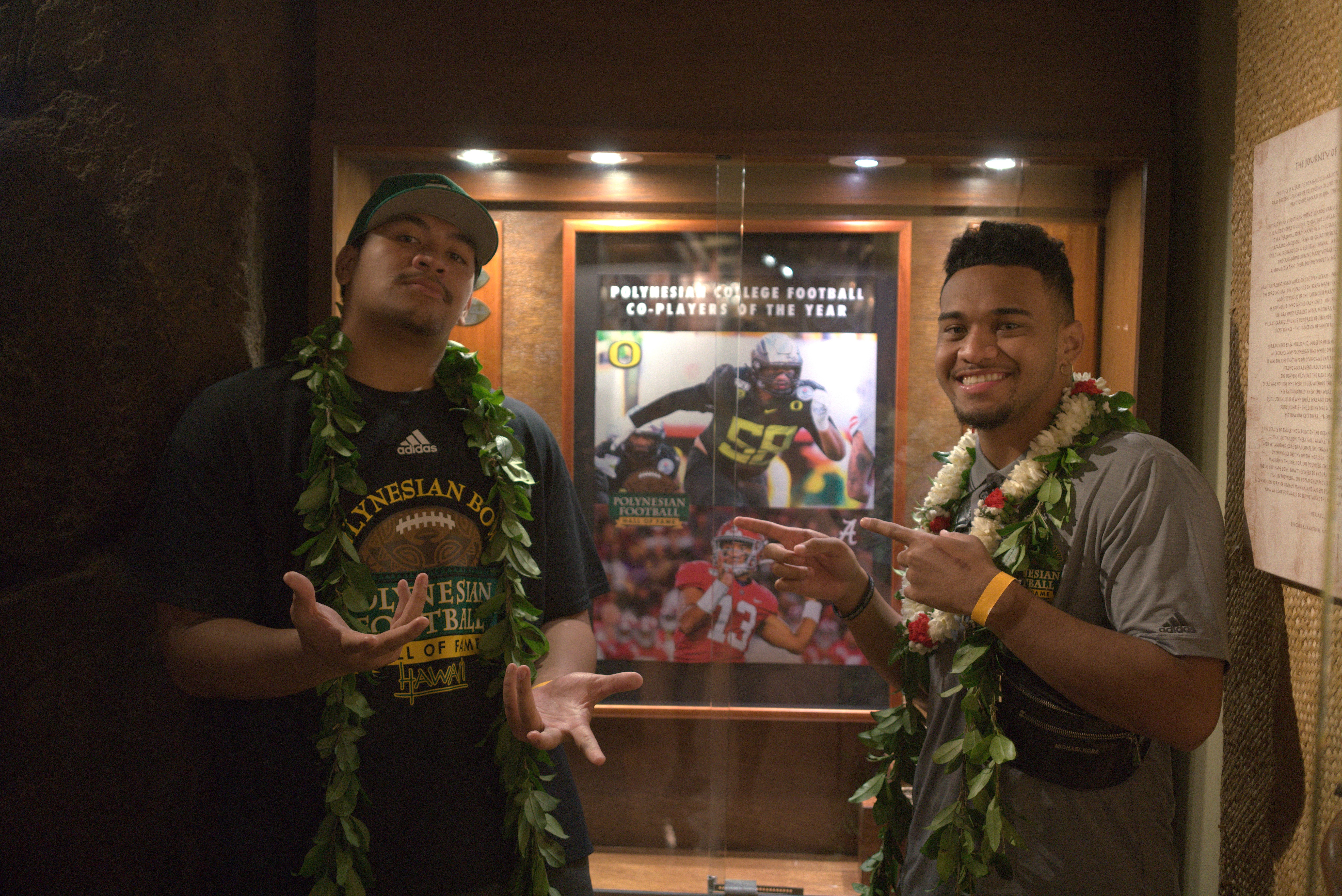 Photo of Peni Sewell (l) and Tua Tagovailoa (r), co-recipients of the 2019 Polynesian Football Hall of Fame College Players of the Year.