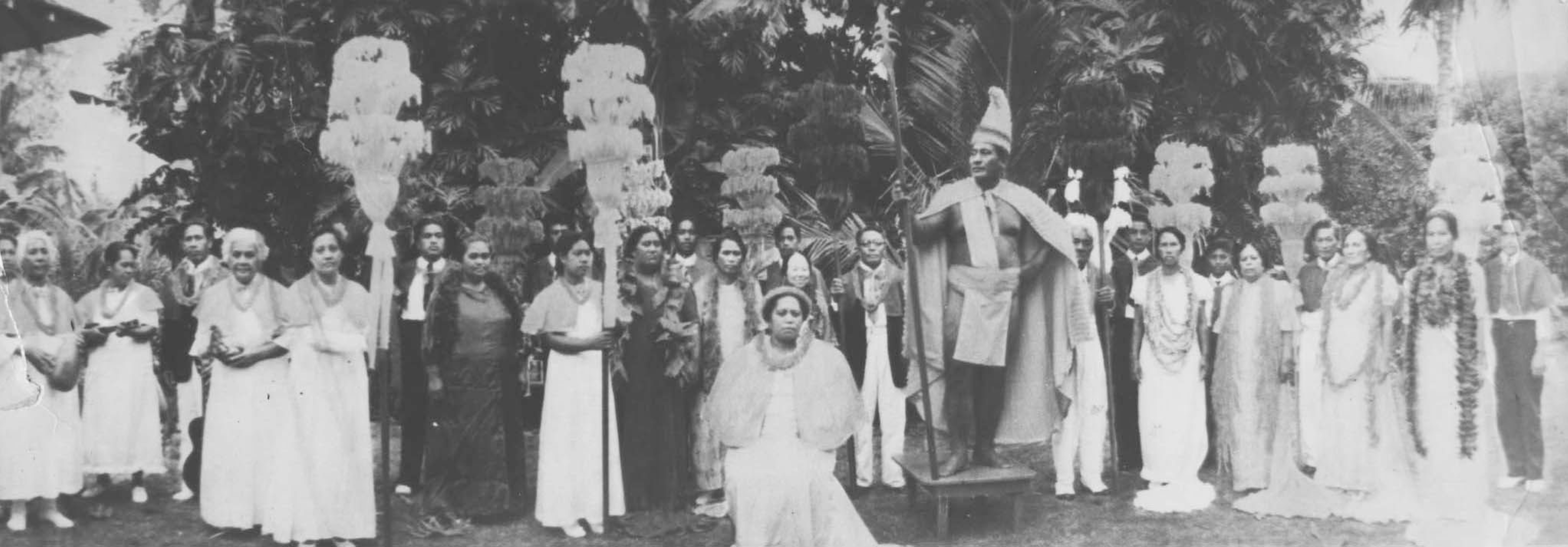 photograph of Hamana Kalili and locals from Laie portraying the royal court of King Kamehameha, with Kalili serving as the king.