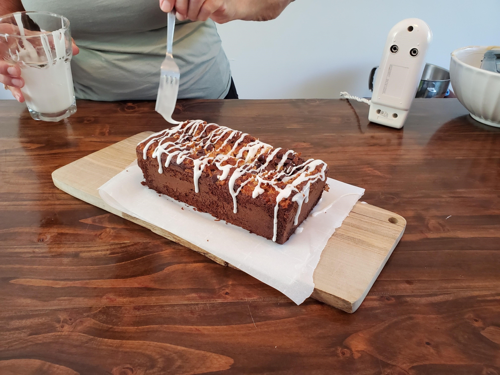 Image of cooked Tropical Banana Bread being topped with glaze