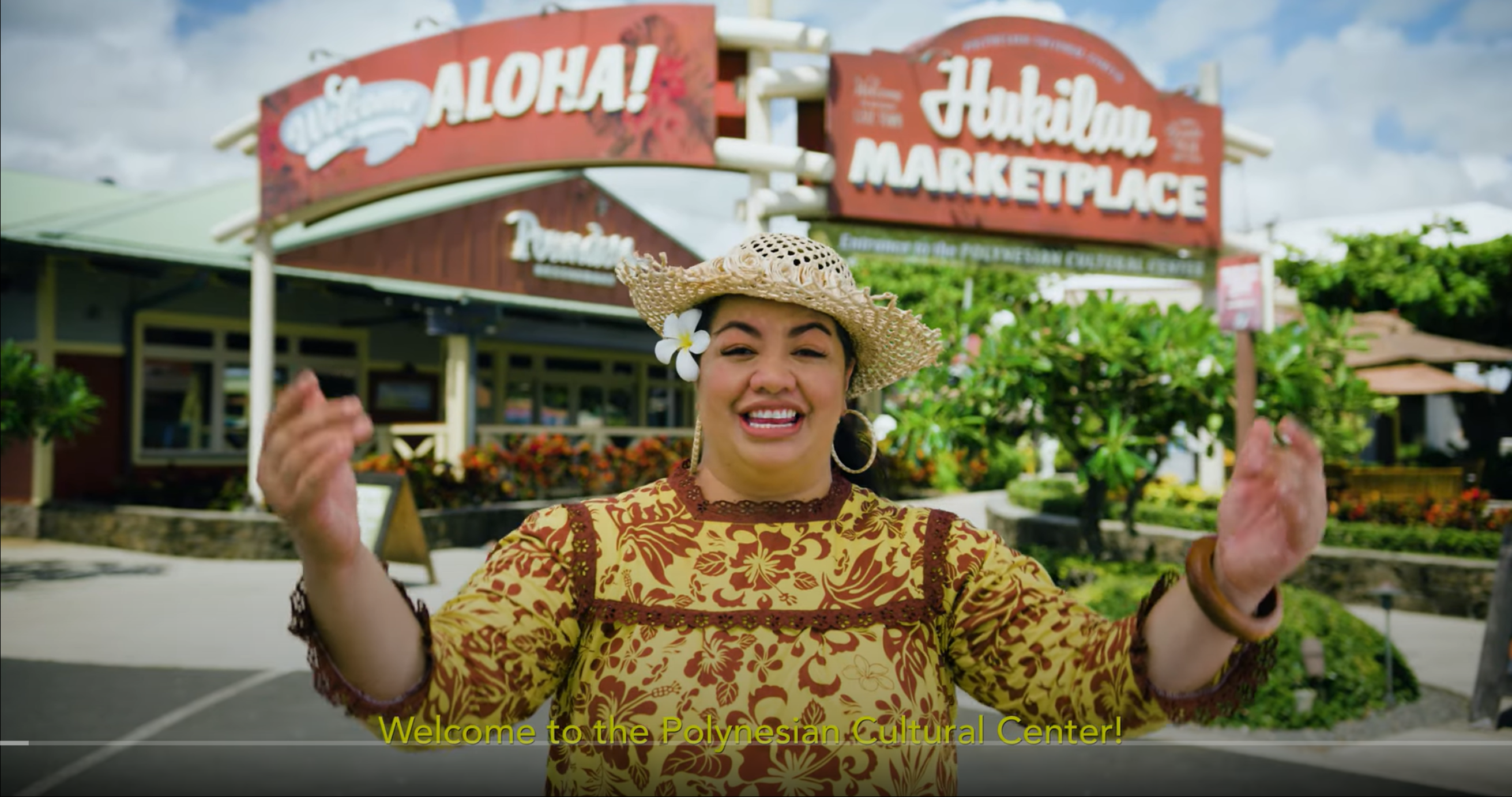 Telesia Tonga welcoming guests to the Polynesian Cultural Center and Hukilau Marketplace