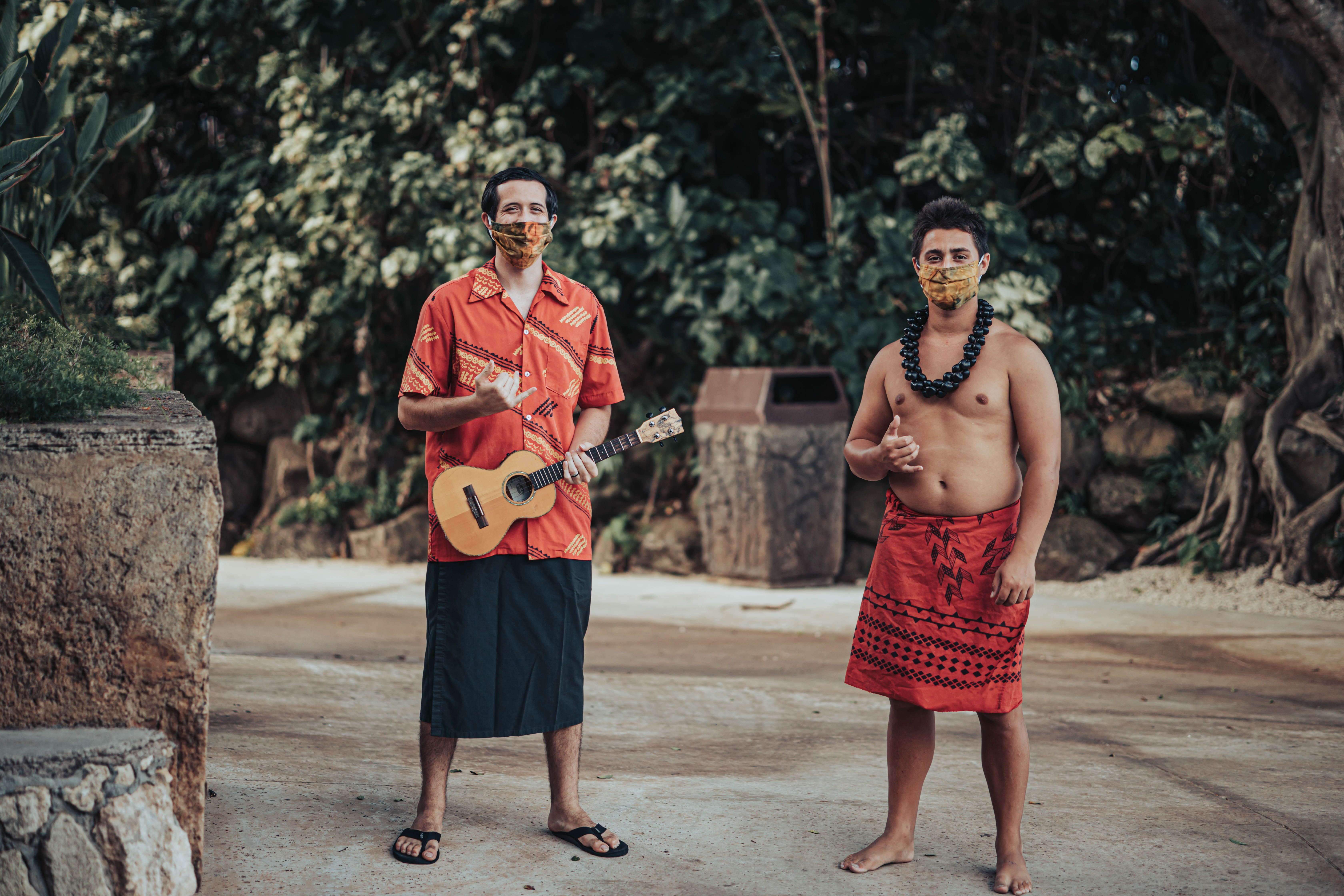 photograph of two island villagers at the Polynesian Cultural Center ukulele shaka northshore oahu hawaii