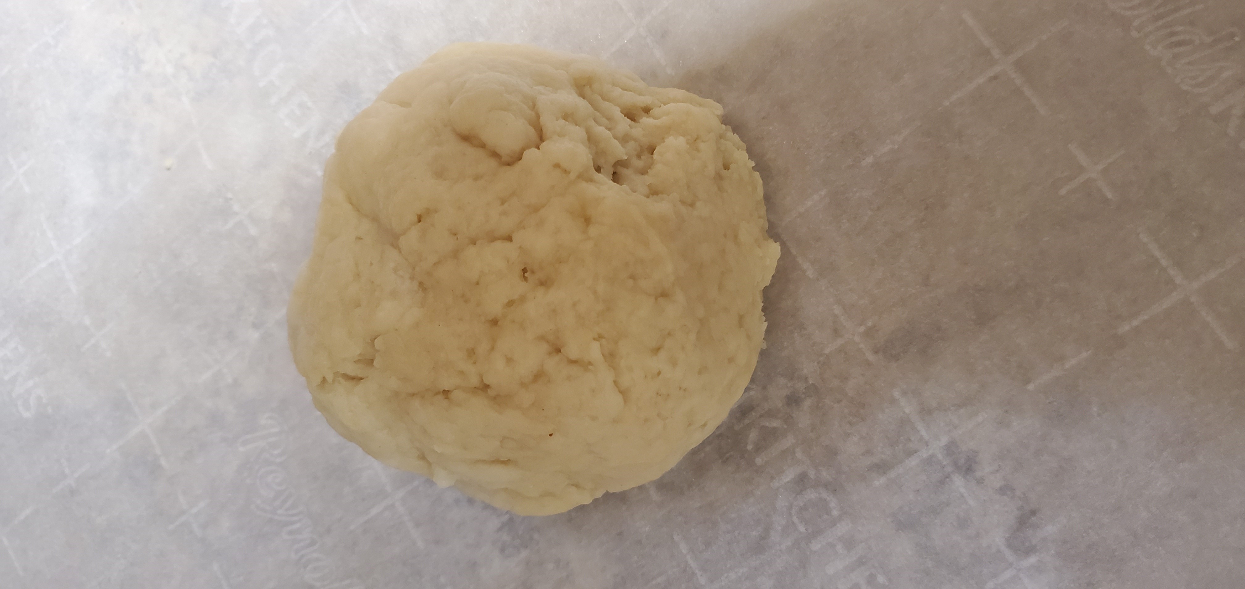 Ball of simple dough ready to form into flat rounds
