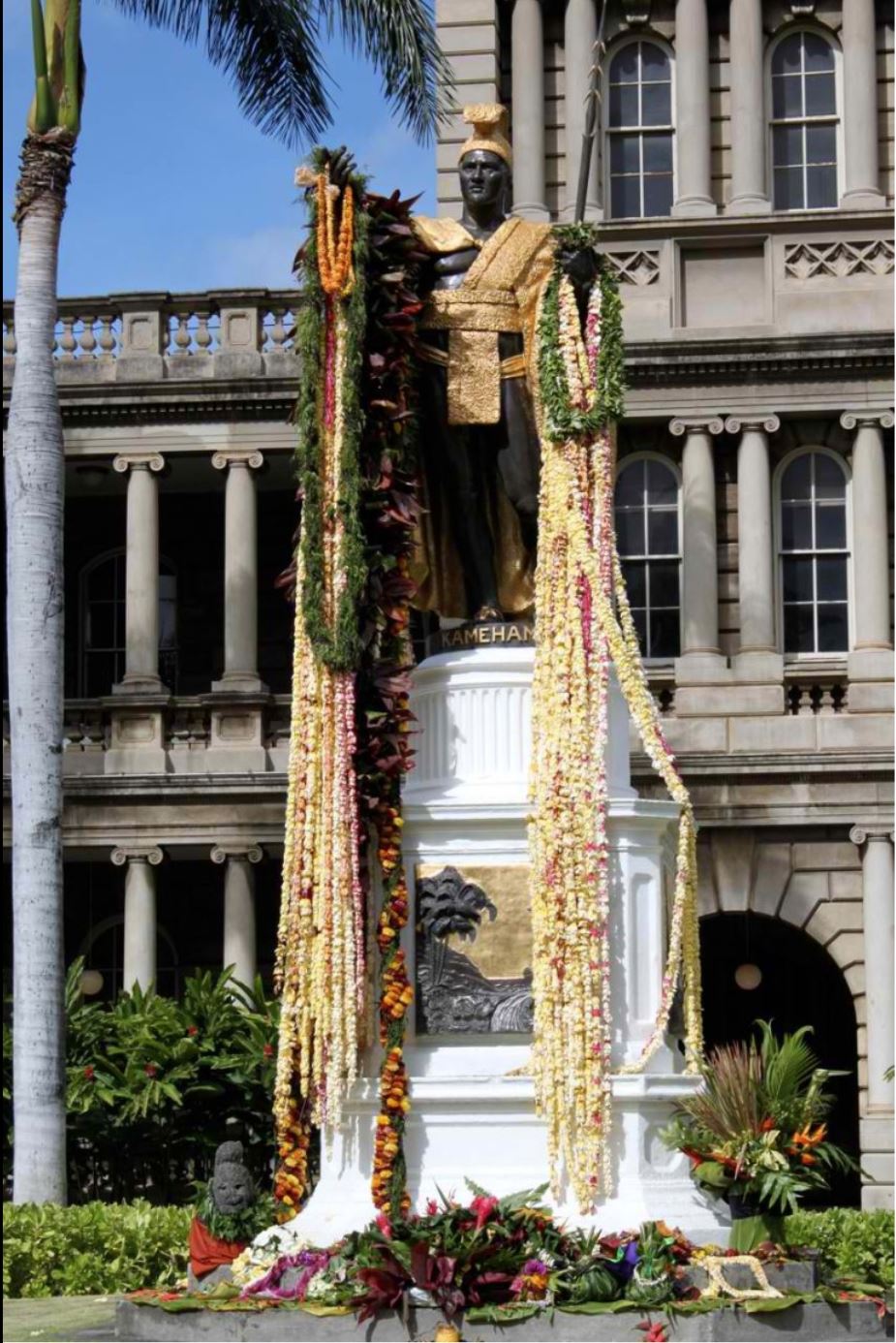 A statue of King Kamehameha I in front of the legislative buildings of Hawaii is draped in flowers every June 11 in commemoration of Kamehameha Day