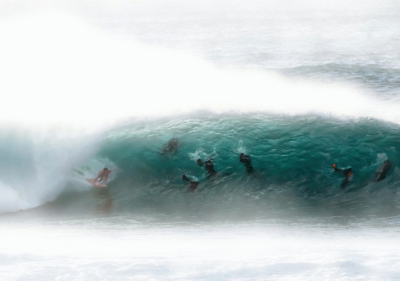 image of multiple surfers by Larry Young - from the Polynesian Cultural Center