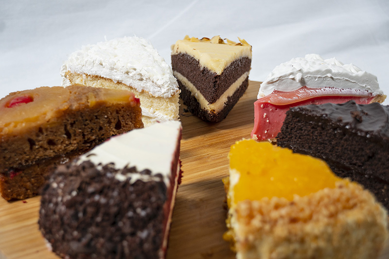 image of six different selections of cake sliced and arranged in a circle