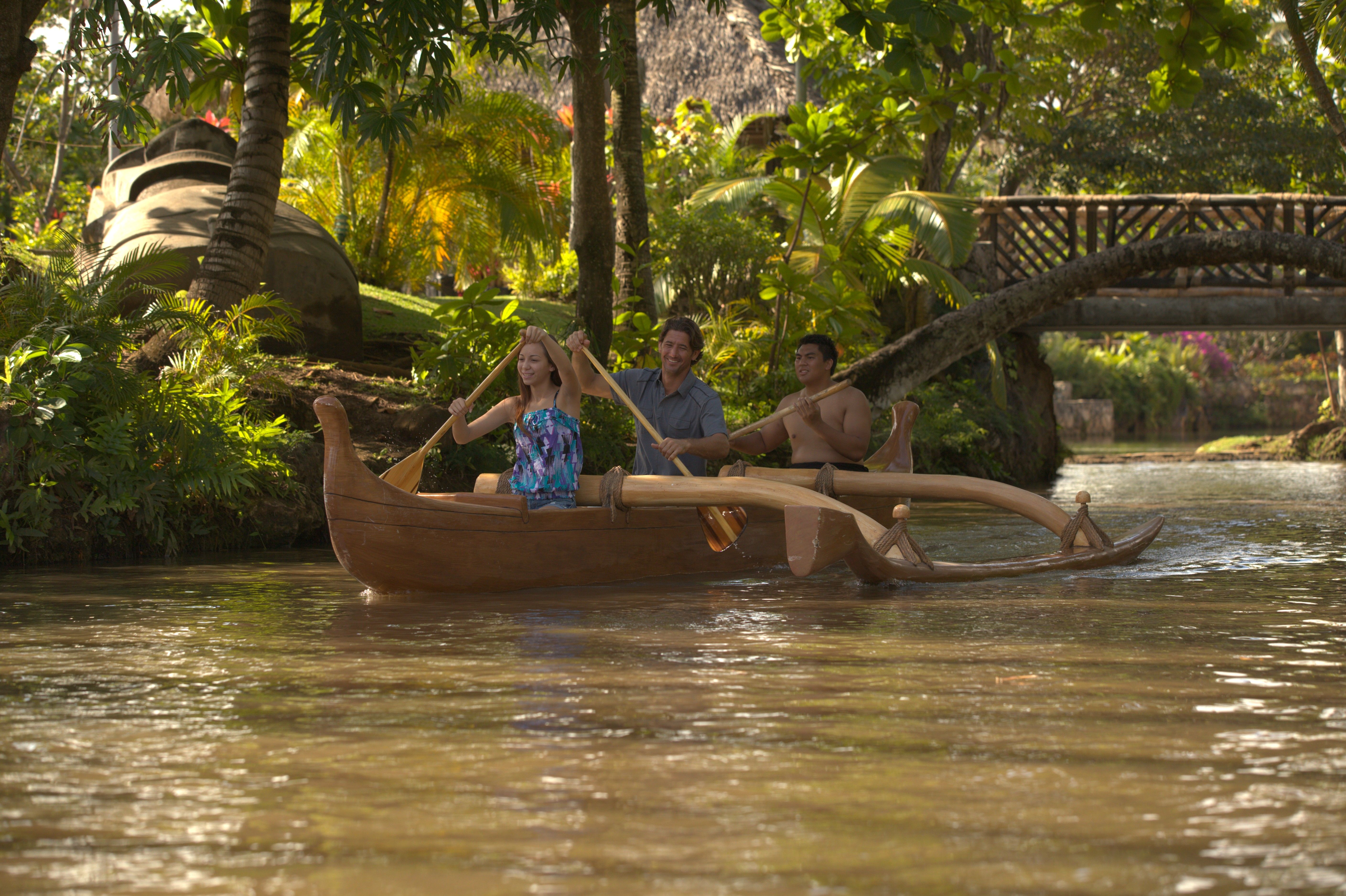 Photo of a couple and PCC employee enjoying paddling a canoe on the lagoon that flows in the Center. One of the 5 romantic activities for couples