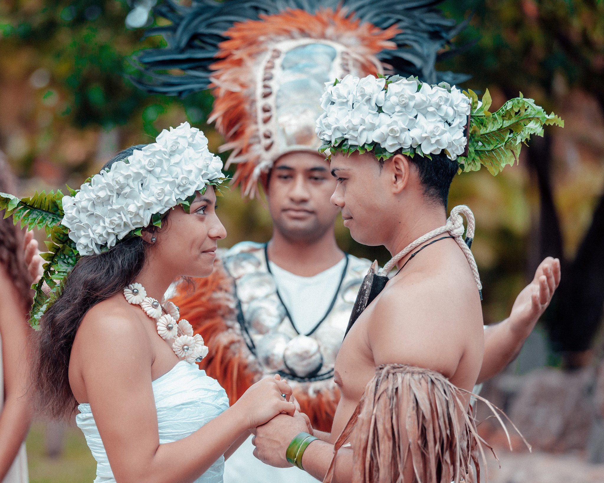 photo of couple performing a traditional Tahitian Wedding ceremony at the Polynesian Cultural Center. Recall the sweet moments in the Tahitian wedding ceremony.