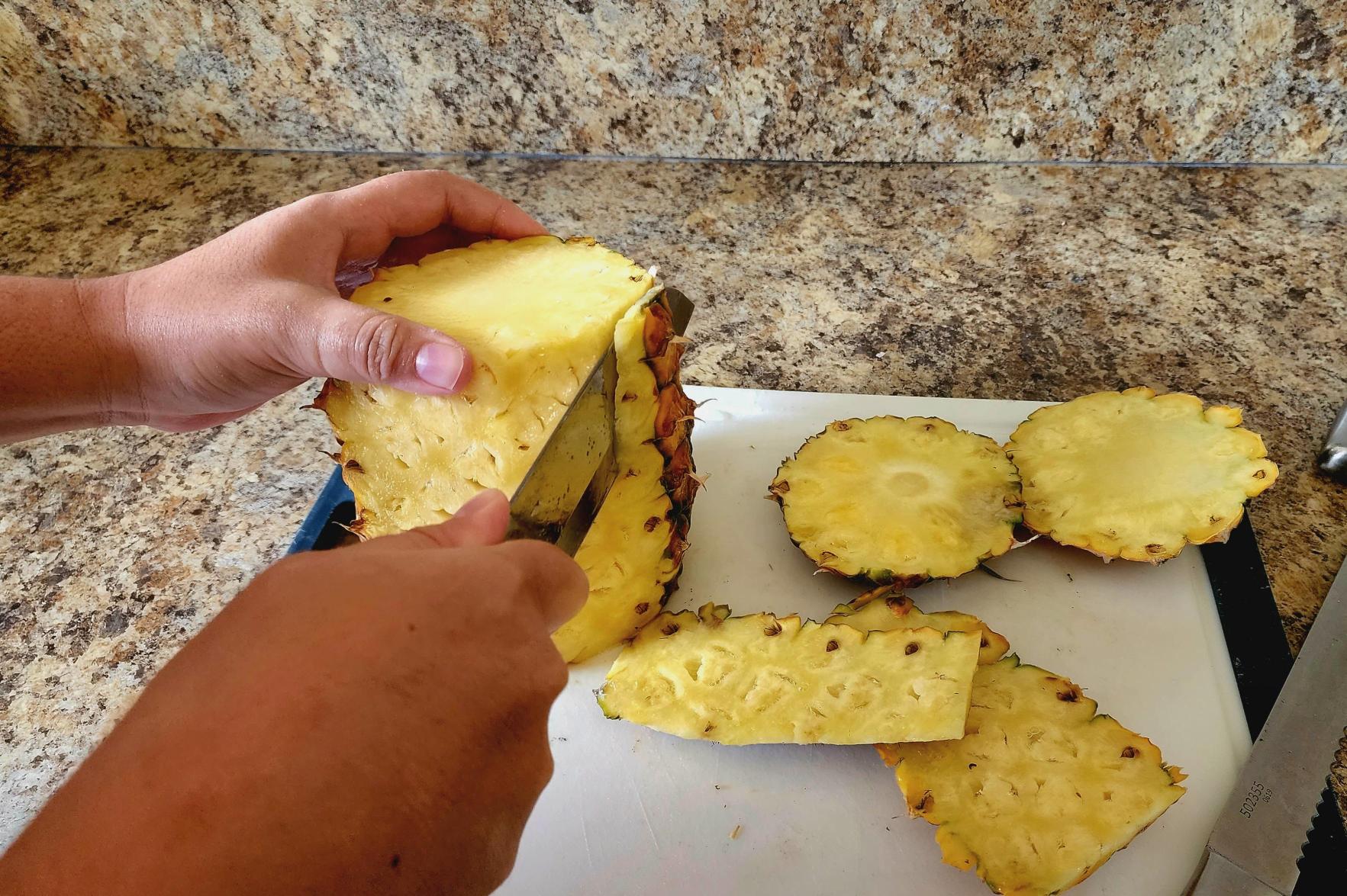 photo of cutting the pineapple skins