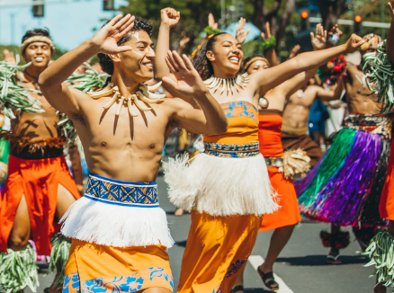 photo of PCC smiling performers during the parade show to celebrate King Kamehameha Day