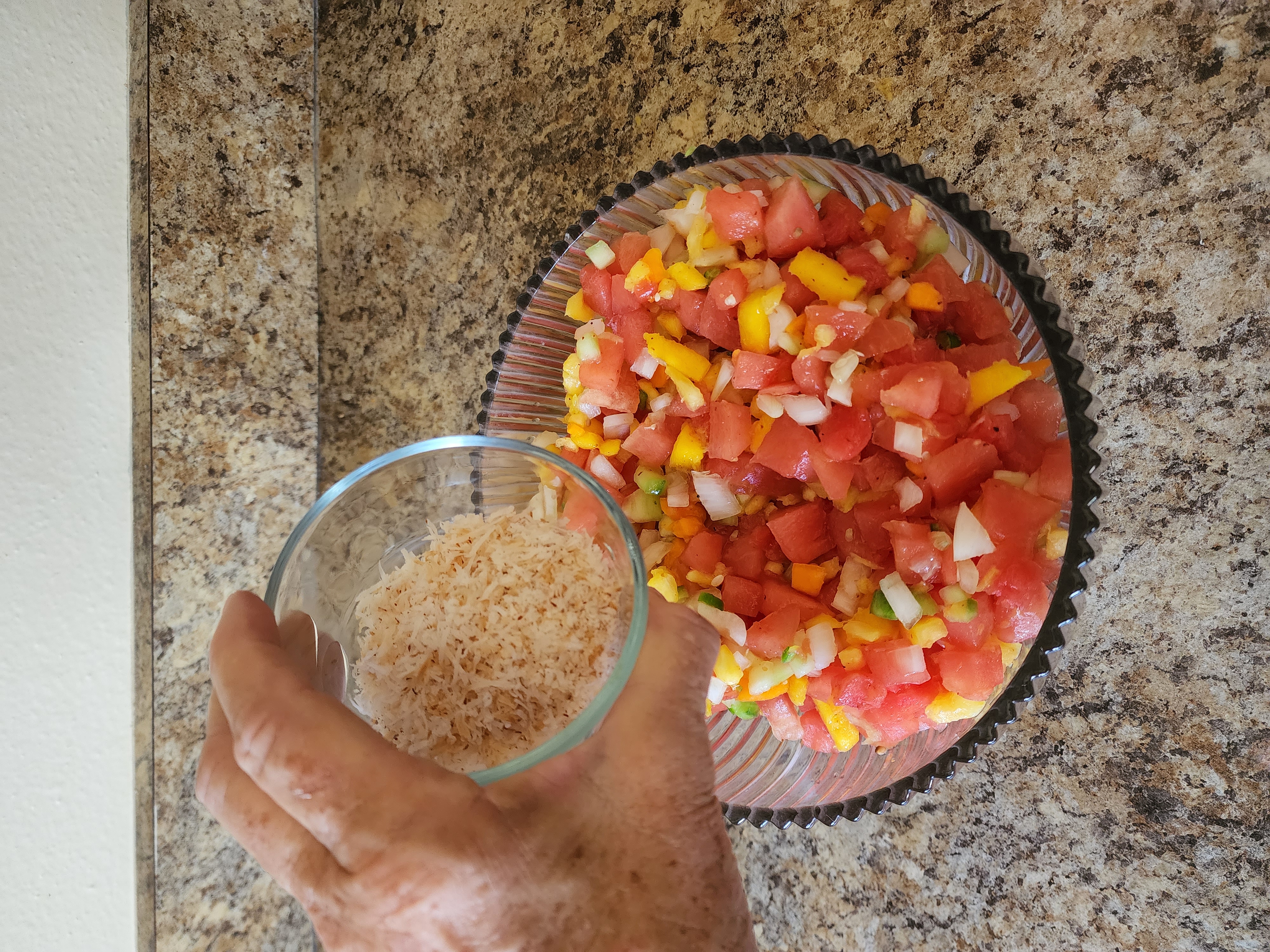 image showing a small amount of shredded coconut on top of the finished salsa