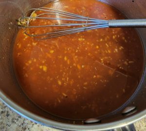 preparing a sweet sauce for the huli huli chicken