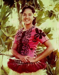 A photograph of Regina Pasi, a former Polynesian Cultural Center employee in her 60s. 