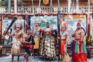 photo of six young men representing the six Polynesian islands (Samoa, Hawaii, Tahiti, Fiji, Tonga, and New Zealand) in their traditional attire