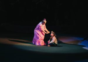 Grandmother dances hula to grandson who is watching. Grandparents are important in Hawaiian culture.