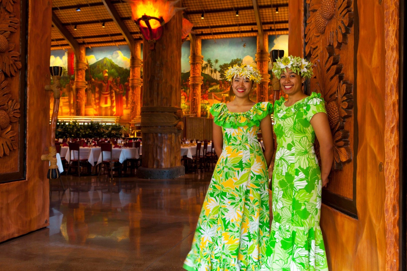 greeters in muumuu at the entrance to Gateway Buffet