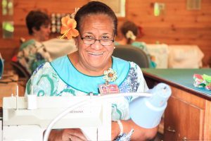Samoan woman sewing