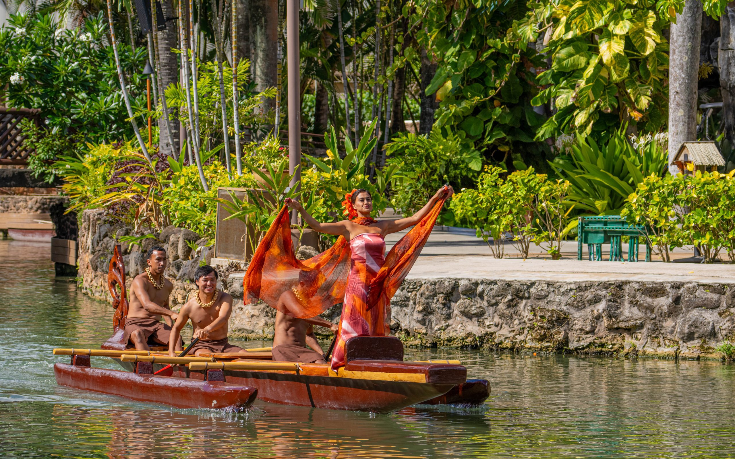 Earth Mother and three canoe pushers at the beginning of the show on a canoe.