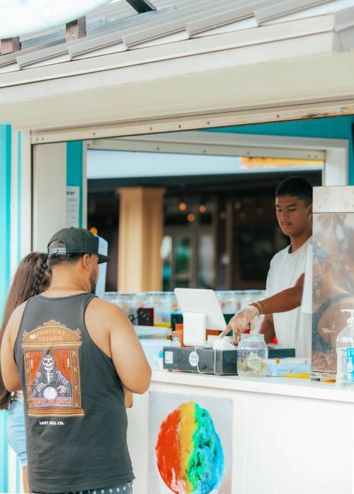 Couple selecting shave ice at food truck window