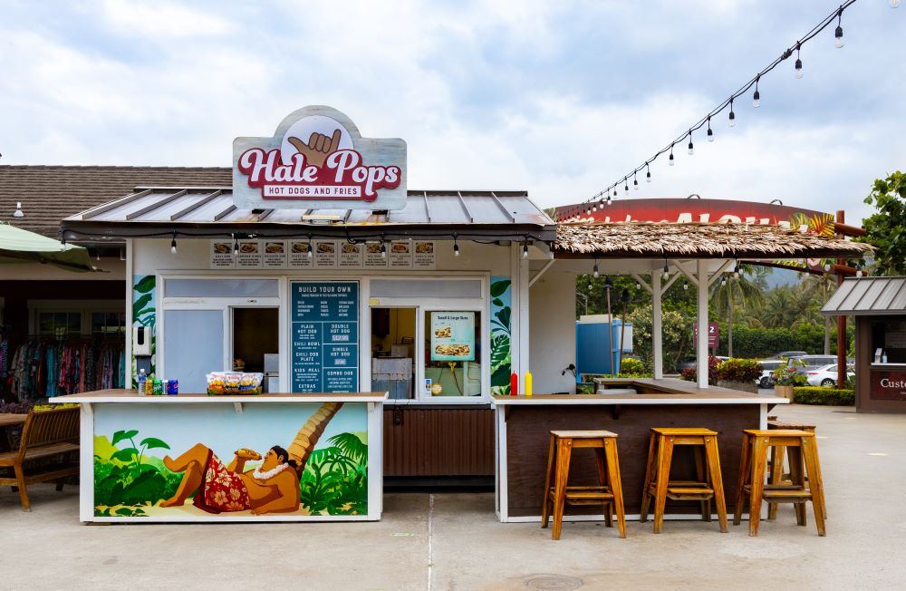 Colorful food truck with mural of relaxing Polynesian