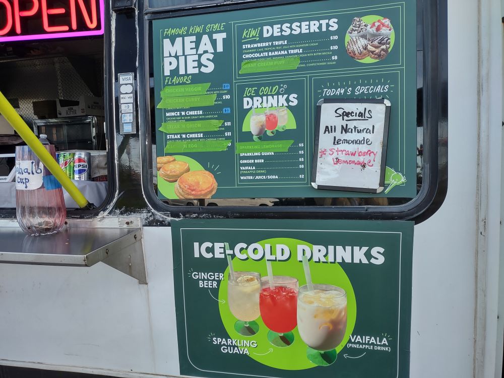 Green menu signs on Kiwi Korner food truck