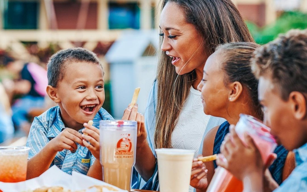 Woman and children enjoying food