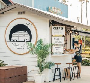 White frame building. North Shore Crepes Cafe.