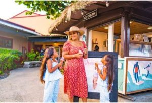 woman and two children enjoying ice cream