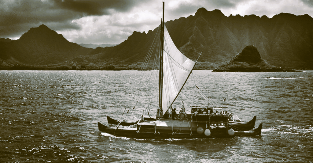 Black and white phot of Iosepa, a replica of a traditional double-hulled canoe.