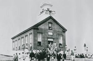 People of La'ie crowd around their newly completed wooden chapel